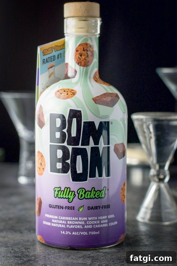 Bom Bom fully baked in the forefront with glasses and measuring glass
