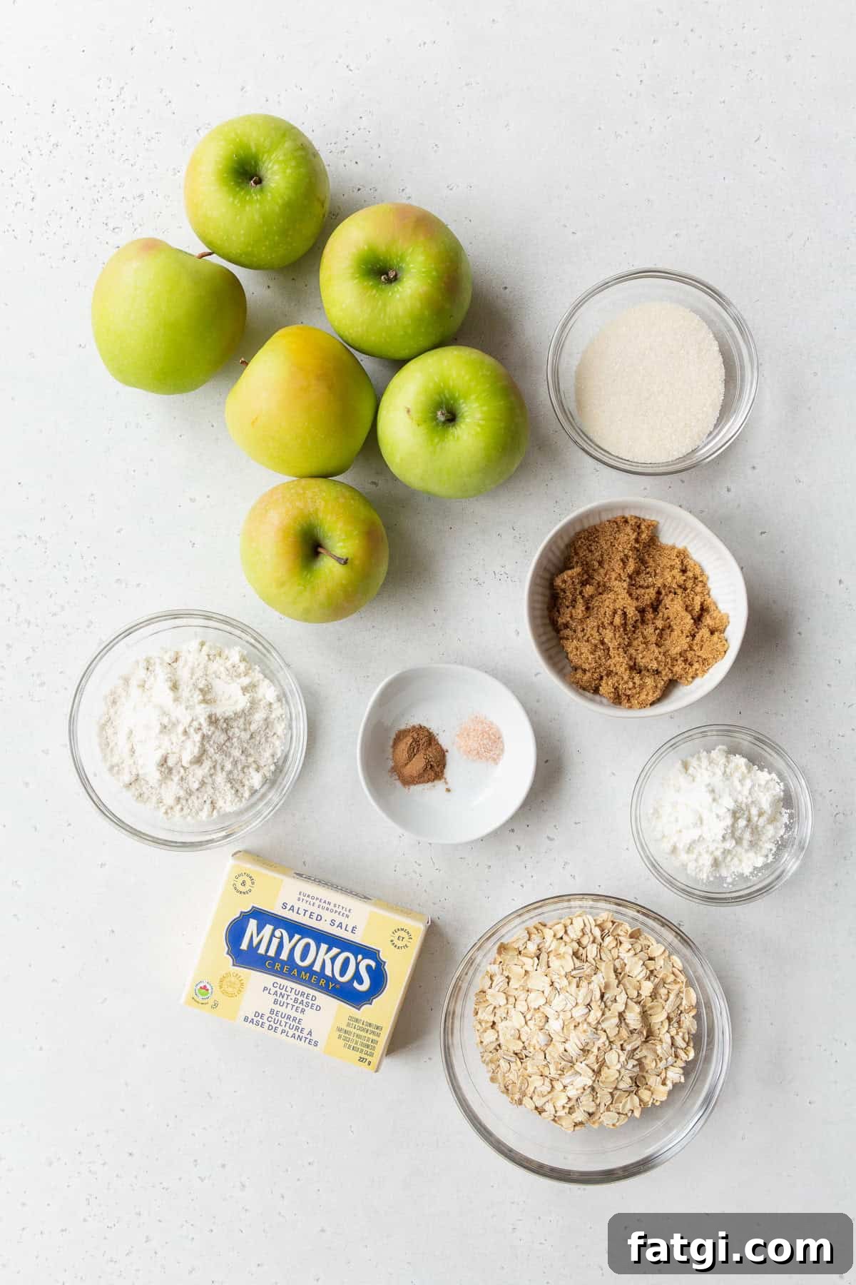 Homemade Gluten-Free Apple Crisp Recipe 3 Ingredients to make gluten-free apple crisp on a light grey surface