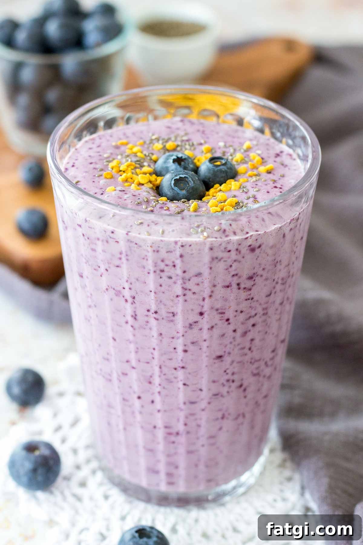 Blueberry Chia Smoothie in a glass with fresh blueberries on top