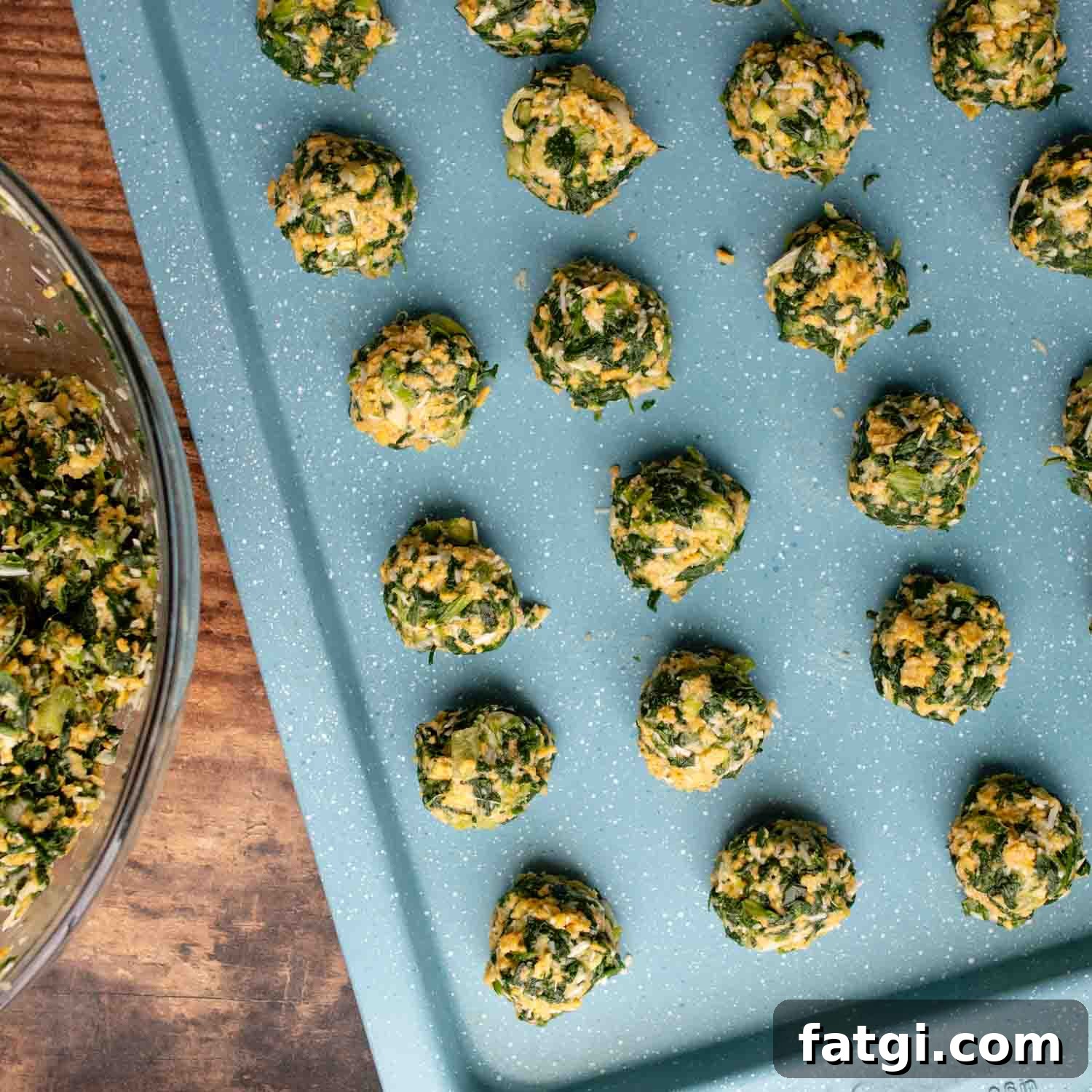 unbaked balls on a baking sheet.