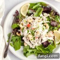 Chicken cashew salad on a bed of spring mix.