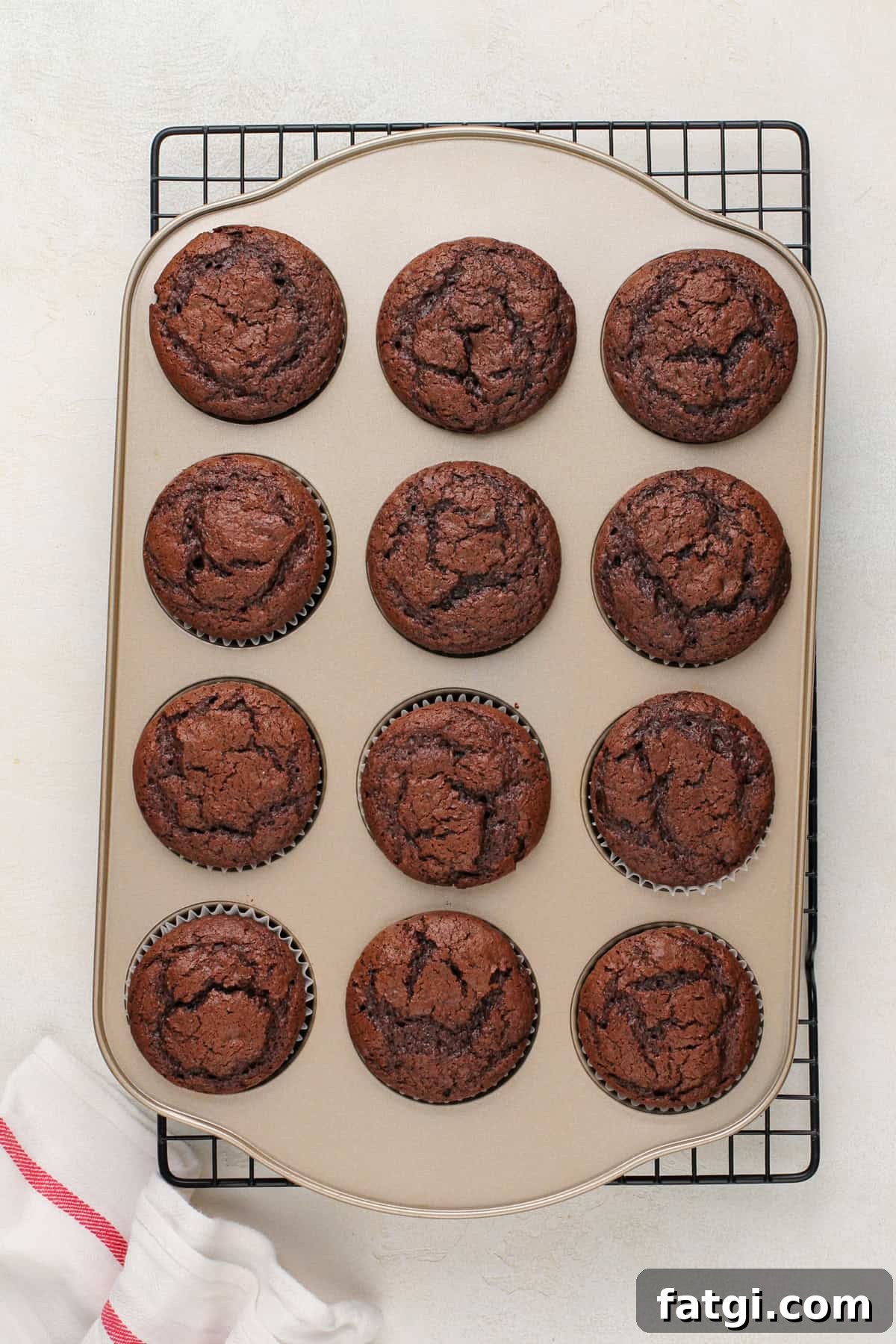 How to Transform Boxed Cake Mix into Gourmet Cakes 7 Baked chocolate cupcakes in a muffin tin.