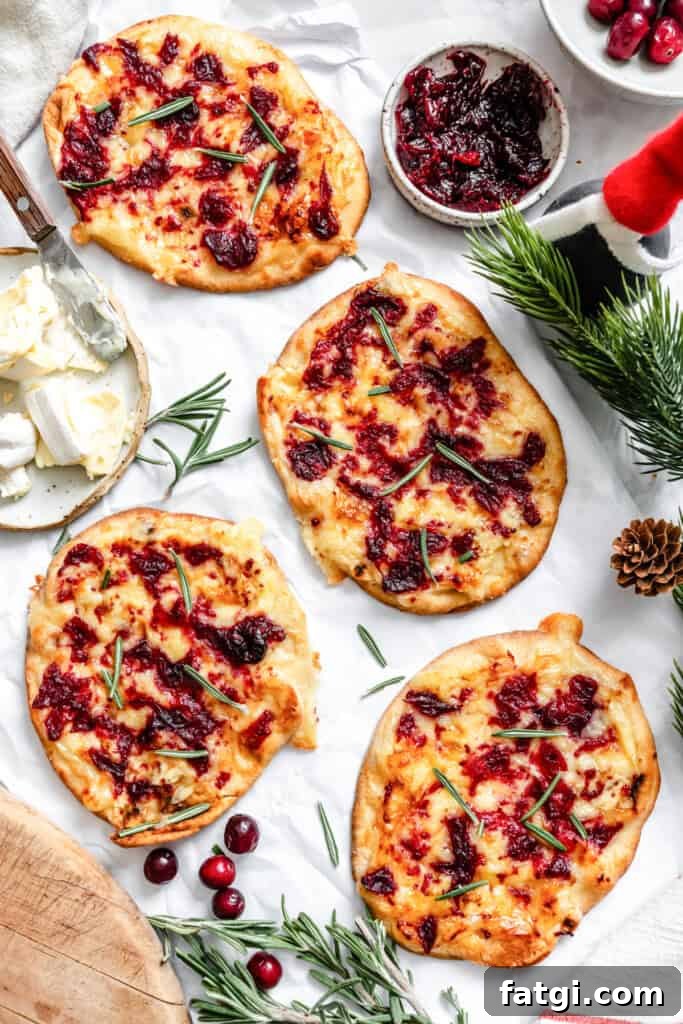Warm Brie Cranberry Naan Bread on a white surface 