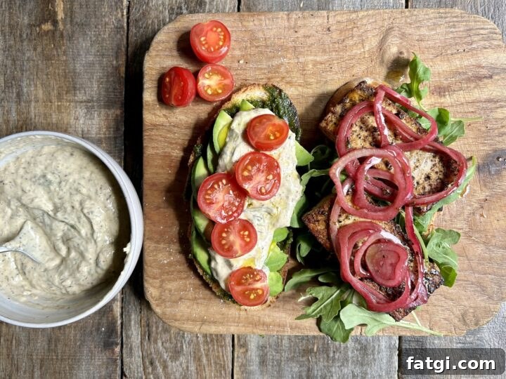 Vegan tofu sandwich on sourdough with greens