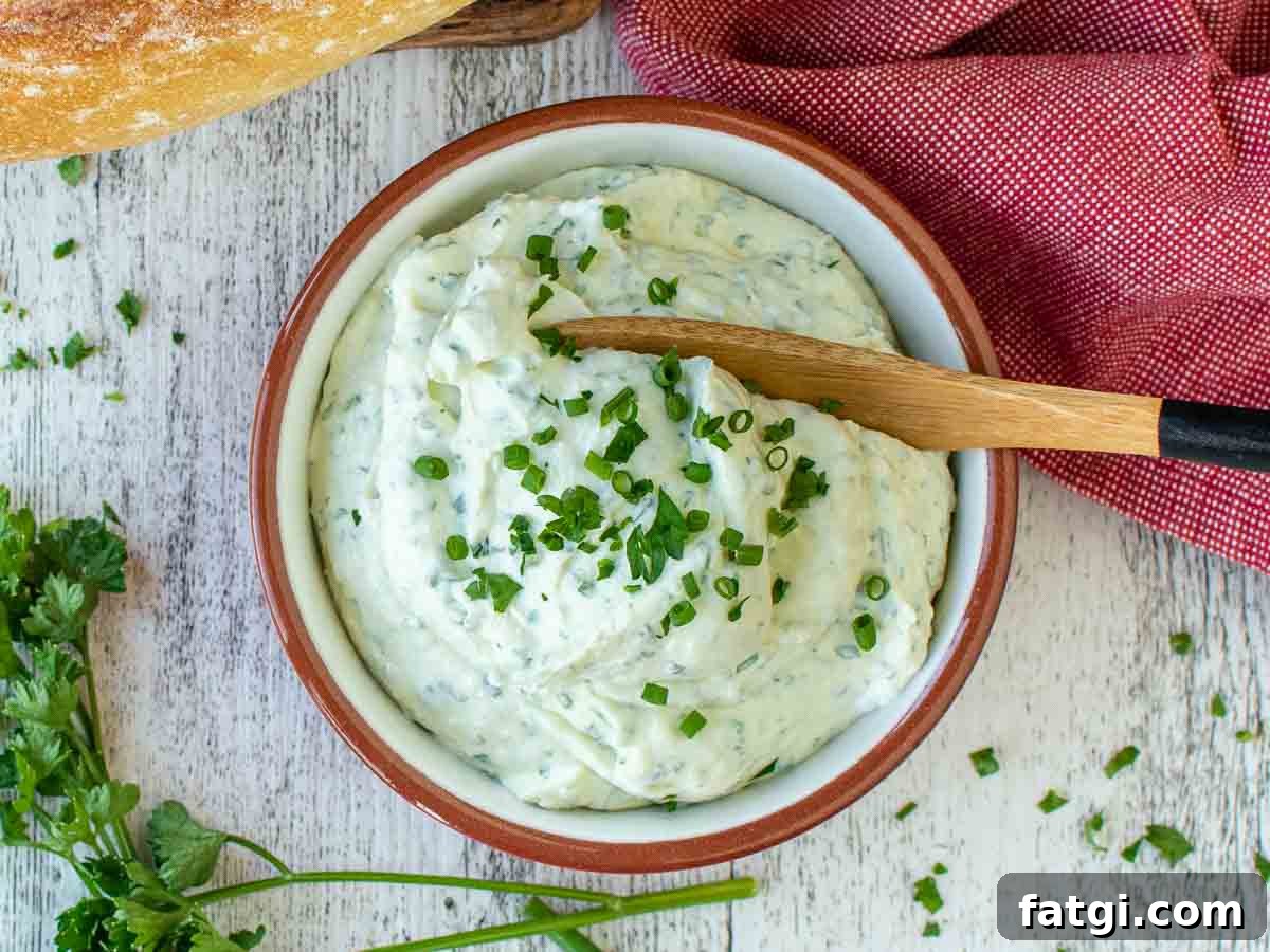 Creamy Homemade Garlic and Herb Cheese Spread Recipe 8 Creamy herb dip in a bowl viewed from above.