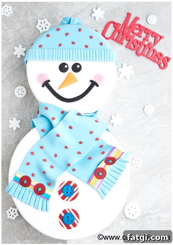 Christmas Snowman Cake With Face and Body on Gray Background