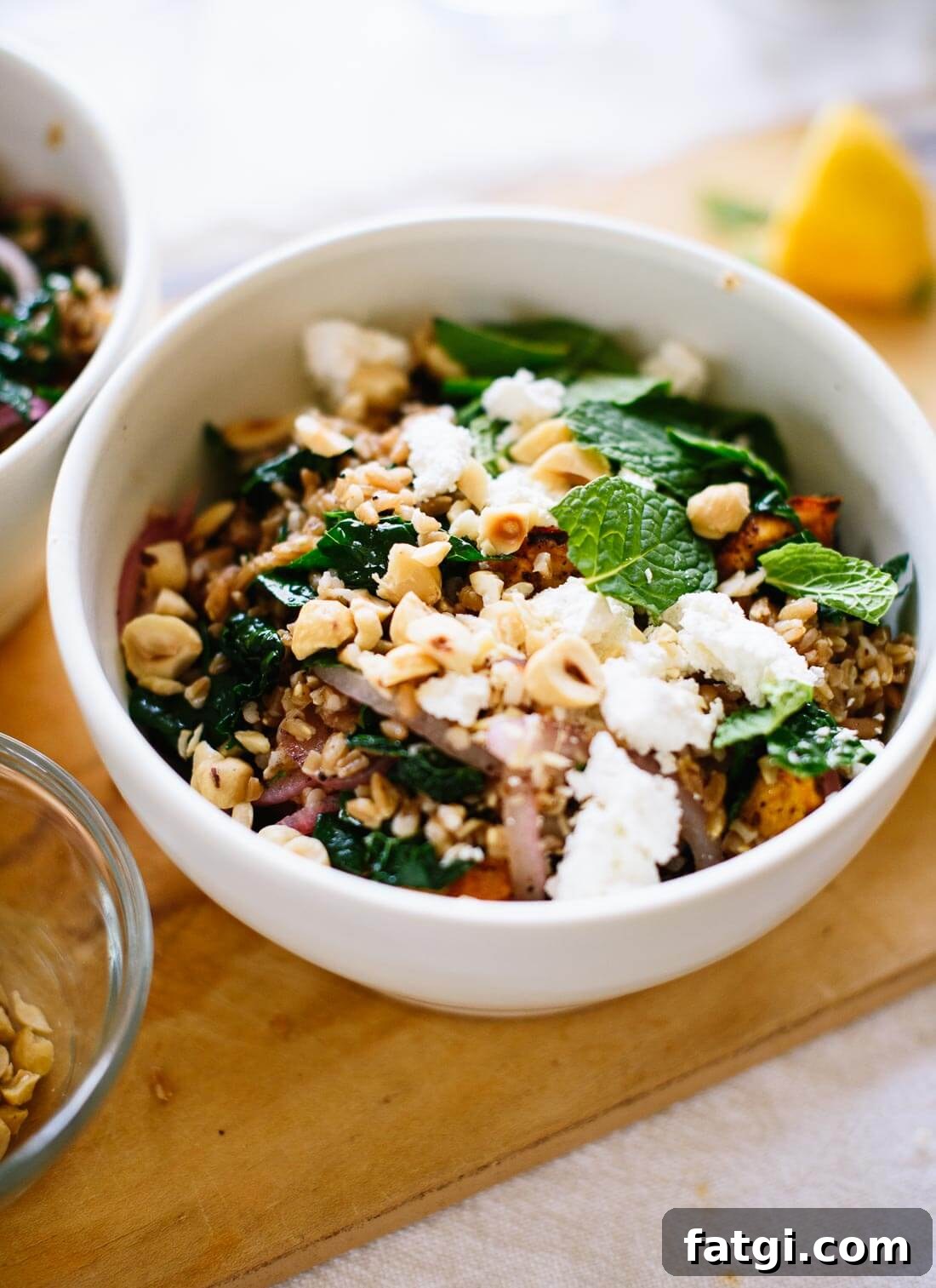 Mediterranean roasted sweet potato farro salad with kale, fresh mint, hazelnuts and cheese