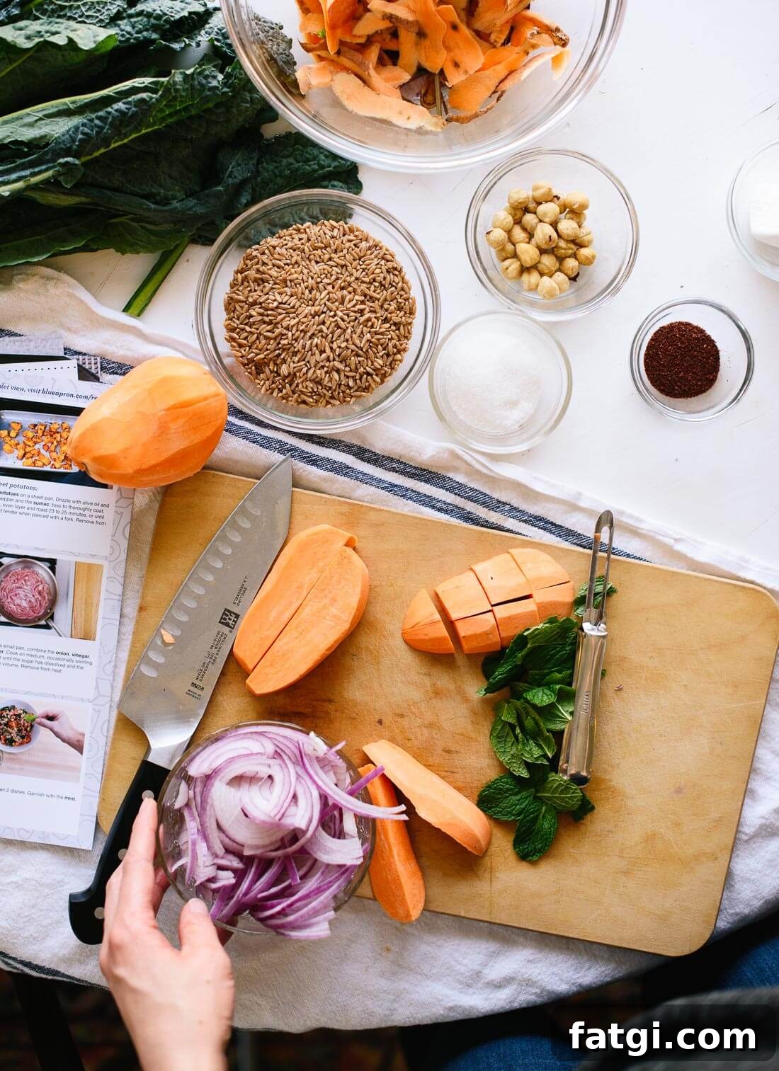 Fresh salad ingredients with sweet potatoes, kale and herbs
