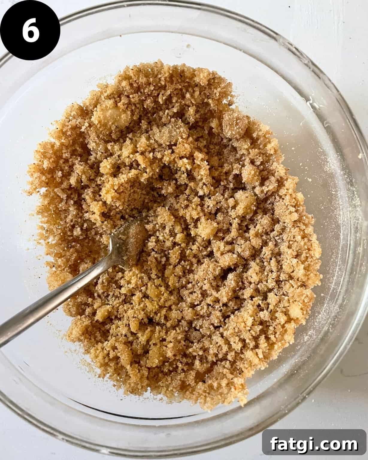 breadcrumb topping tossed together in a small bowl with butter and fresh parsley.