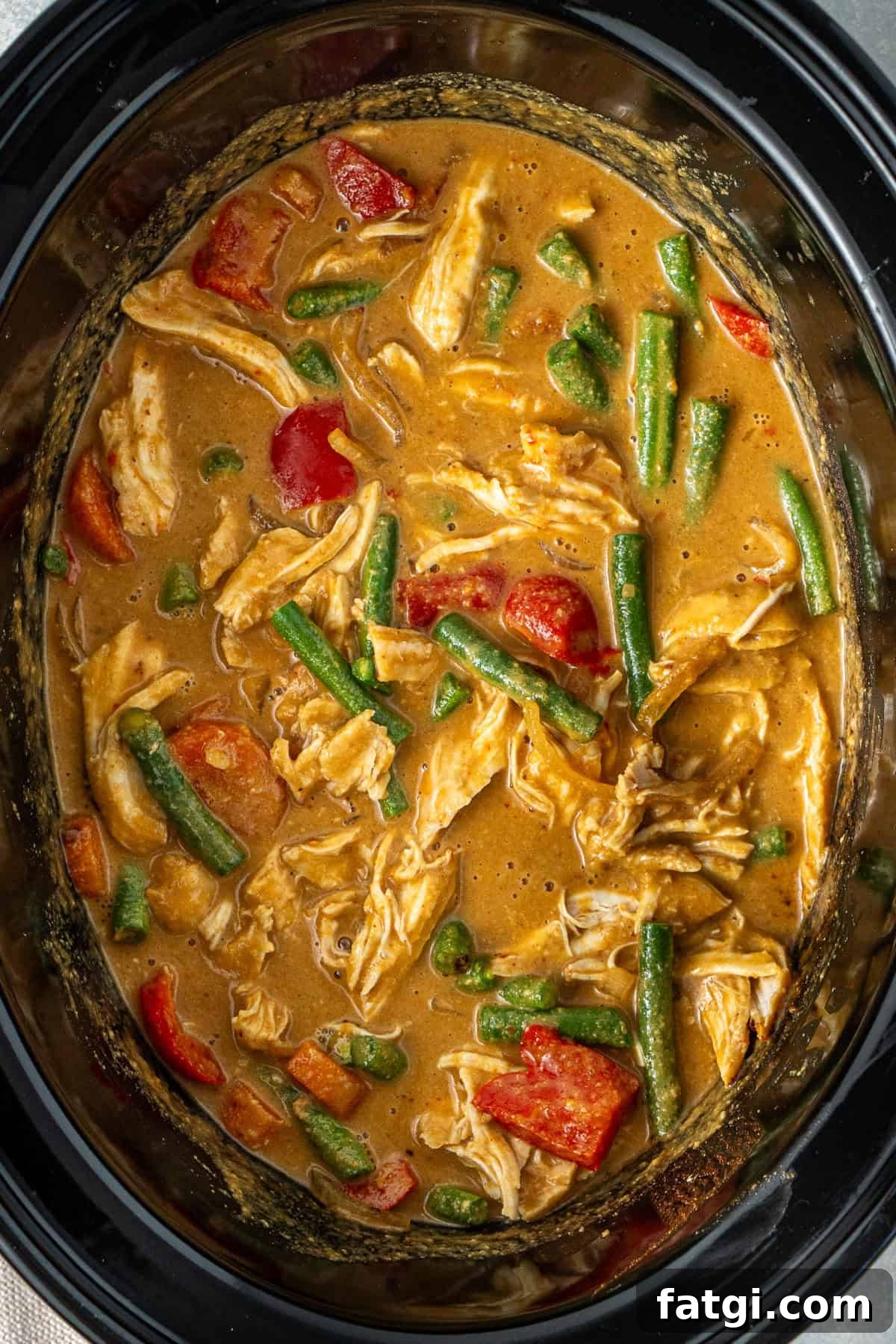 The finished slow cooker satay chicken in the slow cooker.