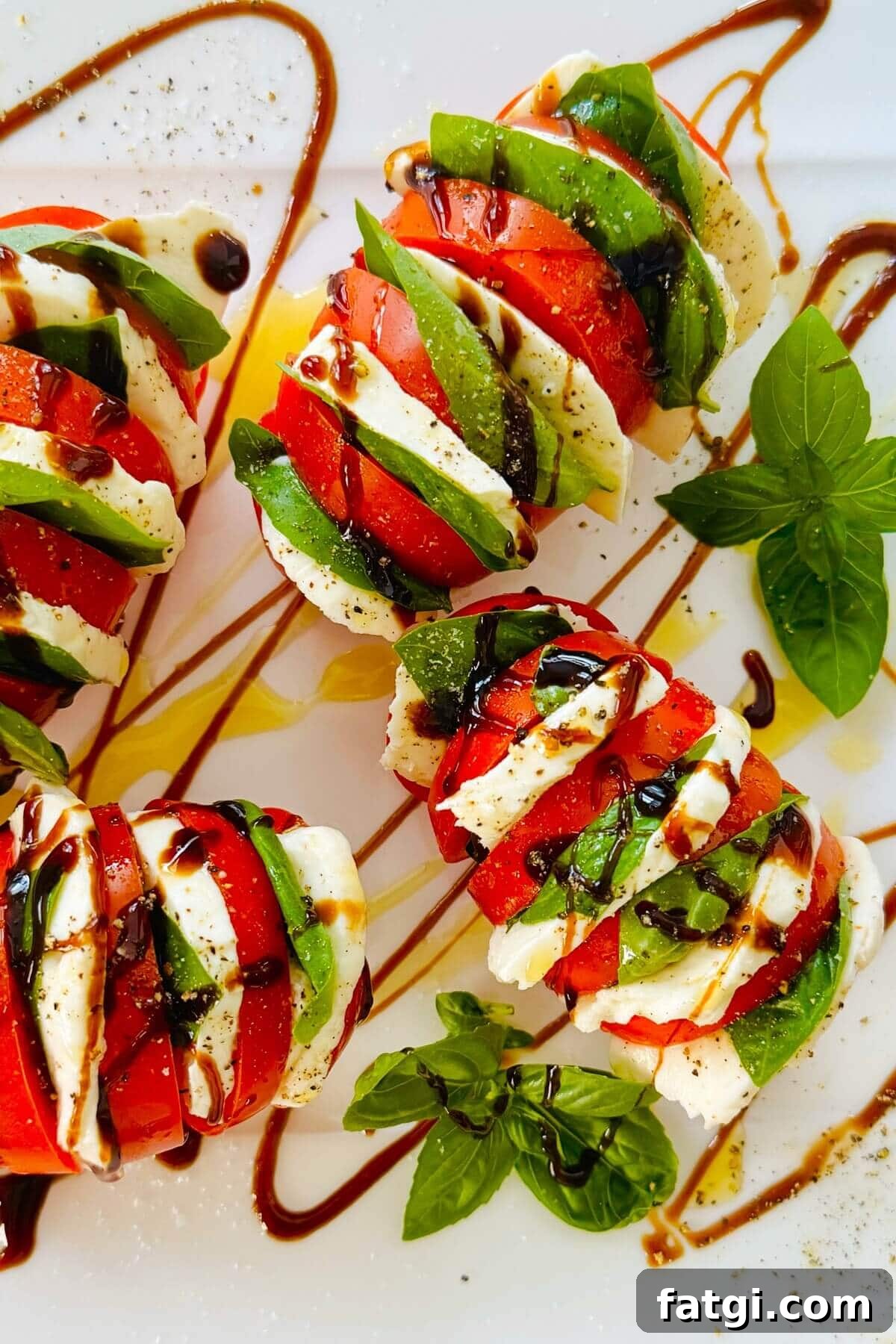 Stuffed Caprese Tomatoes with Mozzarella and Basil 2 tomatoes stuffed with mozzarella and basil.