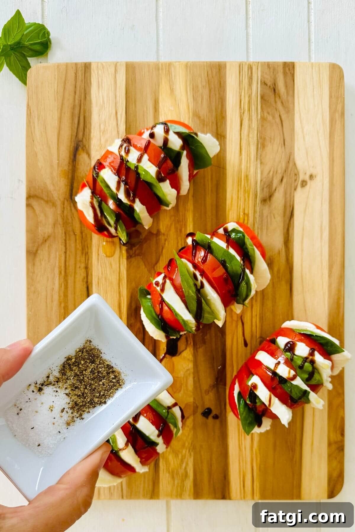 Stuffed Caprese Tomatoes with Mozzarella and Basil 7 salt and pepper with caprese salad tomatoes.