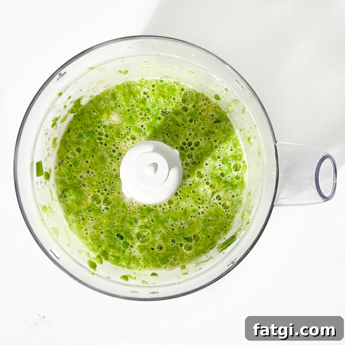 Cheesy Green Pea Fritters Recipe 7 Blended peas, eggs and spring onions in a food processor.