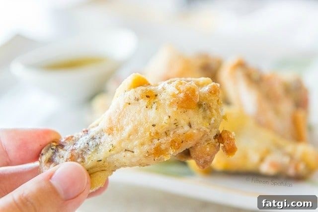 Crispy Garlic Parmesan Chicken Wings 2 Garlic Parmesan Chicken Wings - On a Platter and Held in Hand