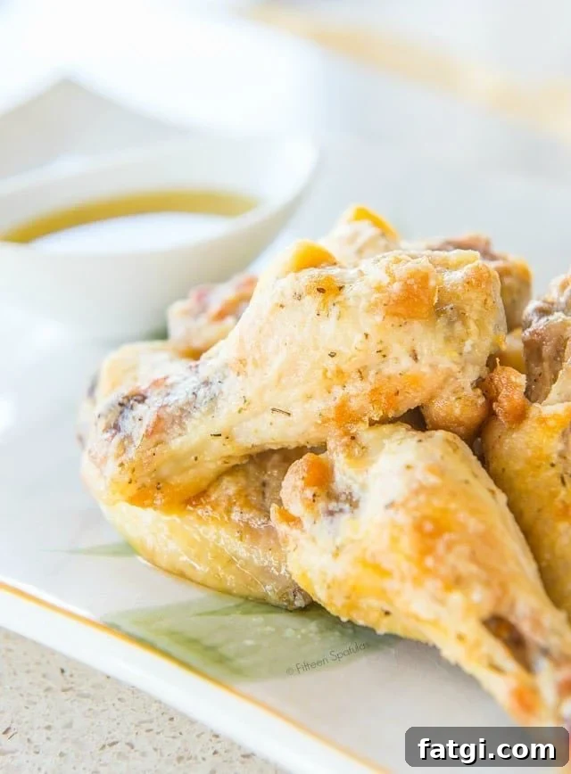 Crispy Garlic Parmesan Chicken Wings 3 Garlic Parmesan Wings - Piled on a Platter with Dipping Sauce