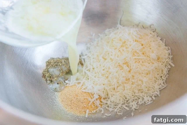 Crispy Garlic Parmesan Chicken Wings 5 Adding Butter to Bowl with Spices, Herbs, and Grated Parmesan