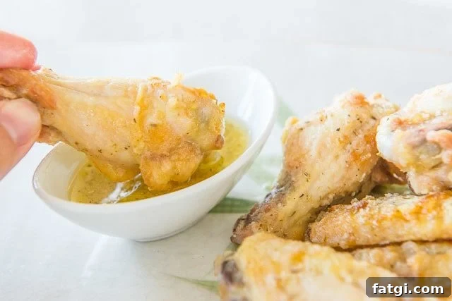 Crispy Garlic Parmesan Chicken Wings 9 Garlic Wings Dipped Into Parmesan Sauce in Bowl