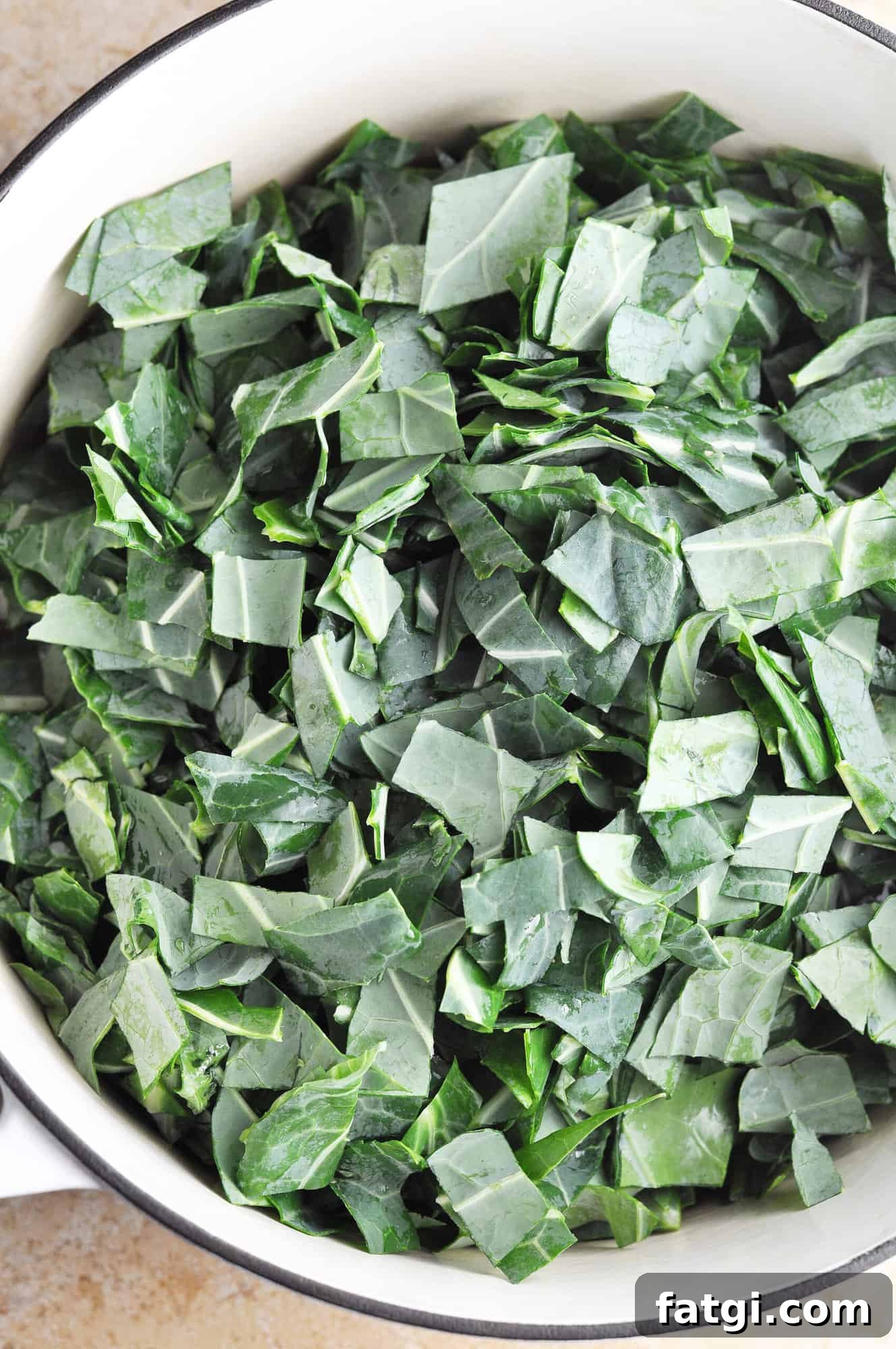 Collard greens added to onions and garlic