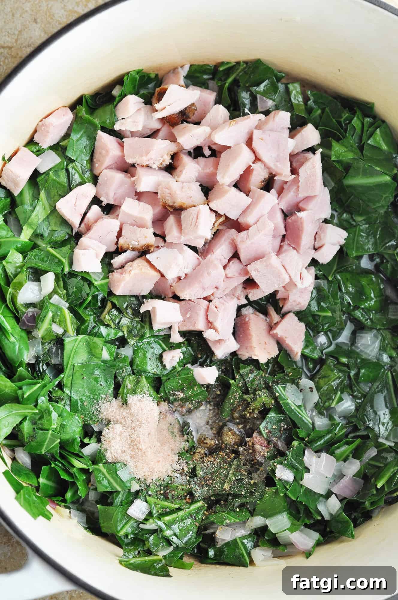 Ham and seasoning added to collard greens