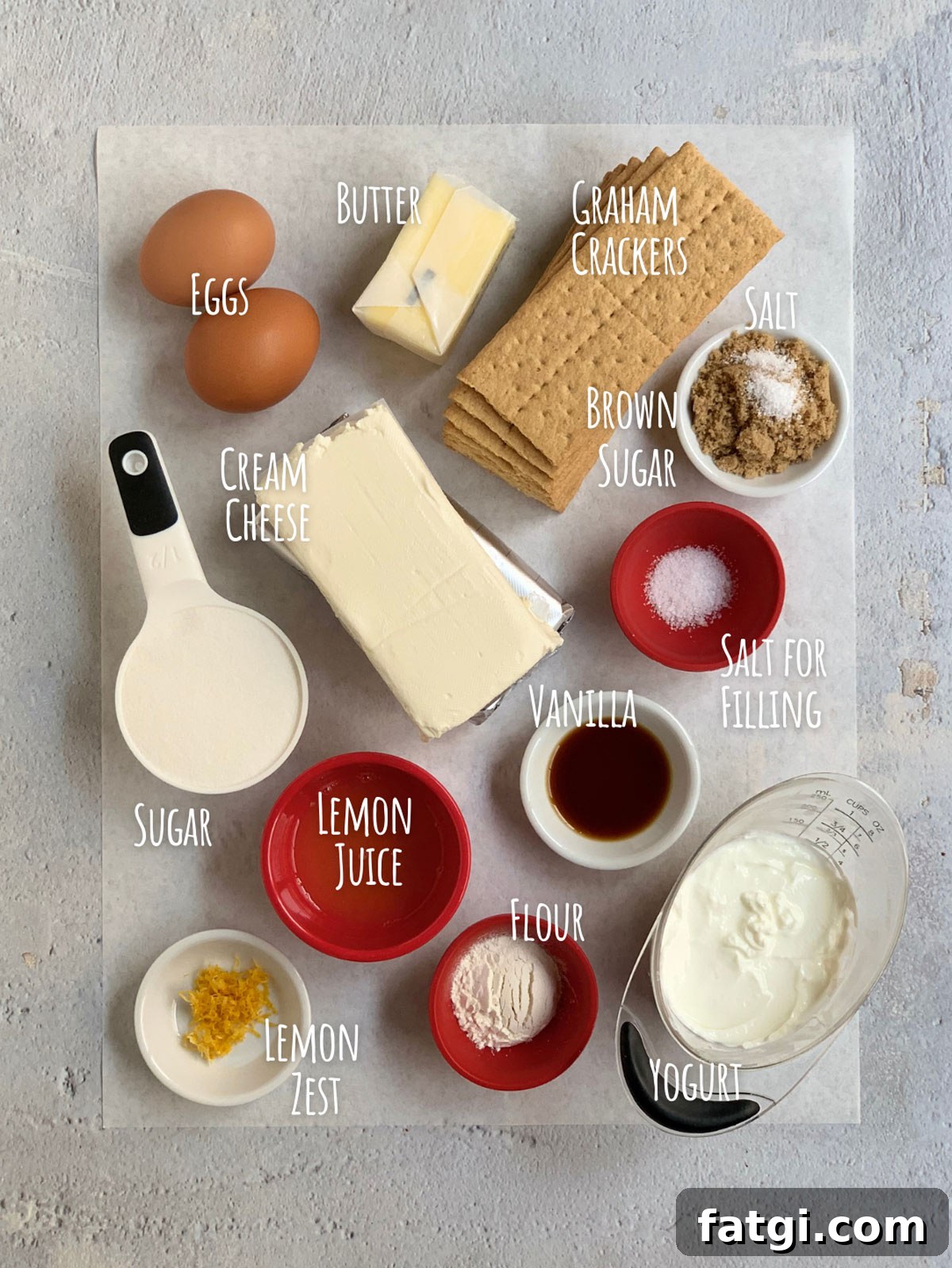 Ingredient shot for mini cheesecake bites show all ingredients on a piece of parchment paper.