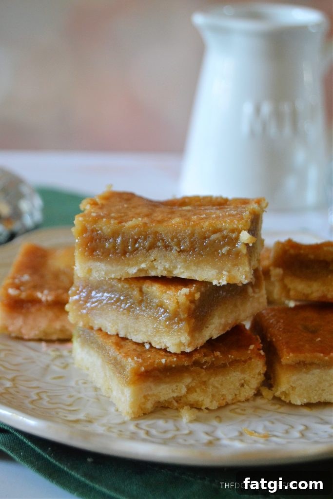 Sugar Pie Bars with Buttery Shortbread Crust 4 a plate of sugar pie squares on a light background with a milk bottle in the background