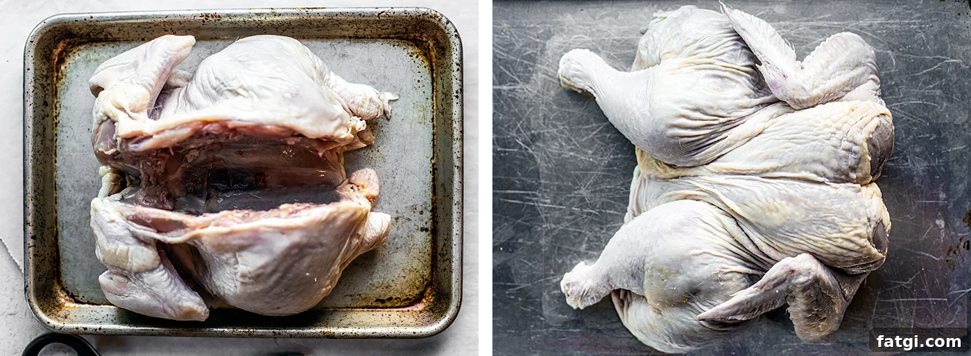 How to Spatchcock a Chicken: Step-by-Step Video 5 Spatchcocked chicken without backbone being flattened on a baking sheet.