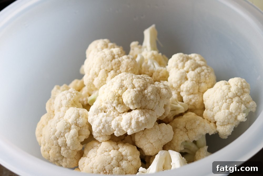 Roasted Zaatar Cauliflower with Golden Tahini Harissa Sauce 4 cauliflower in bowl