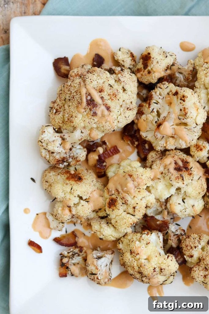 Roasted Zaatar Cauliflower with Golden Tahini Harissa Sauce 8 Plated roasted cauliflower