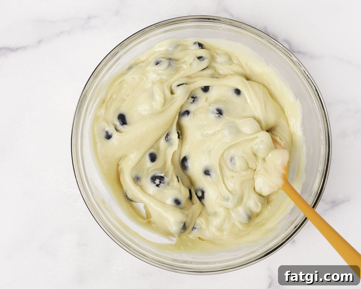 Blueberries folded into muffin batter