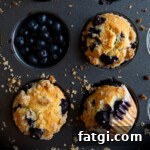 Three dairy free blueberry muffins and blueberry muffins in a muffin tin.