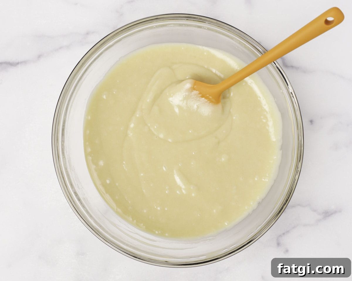 Adding flour to muffin batter
