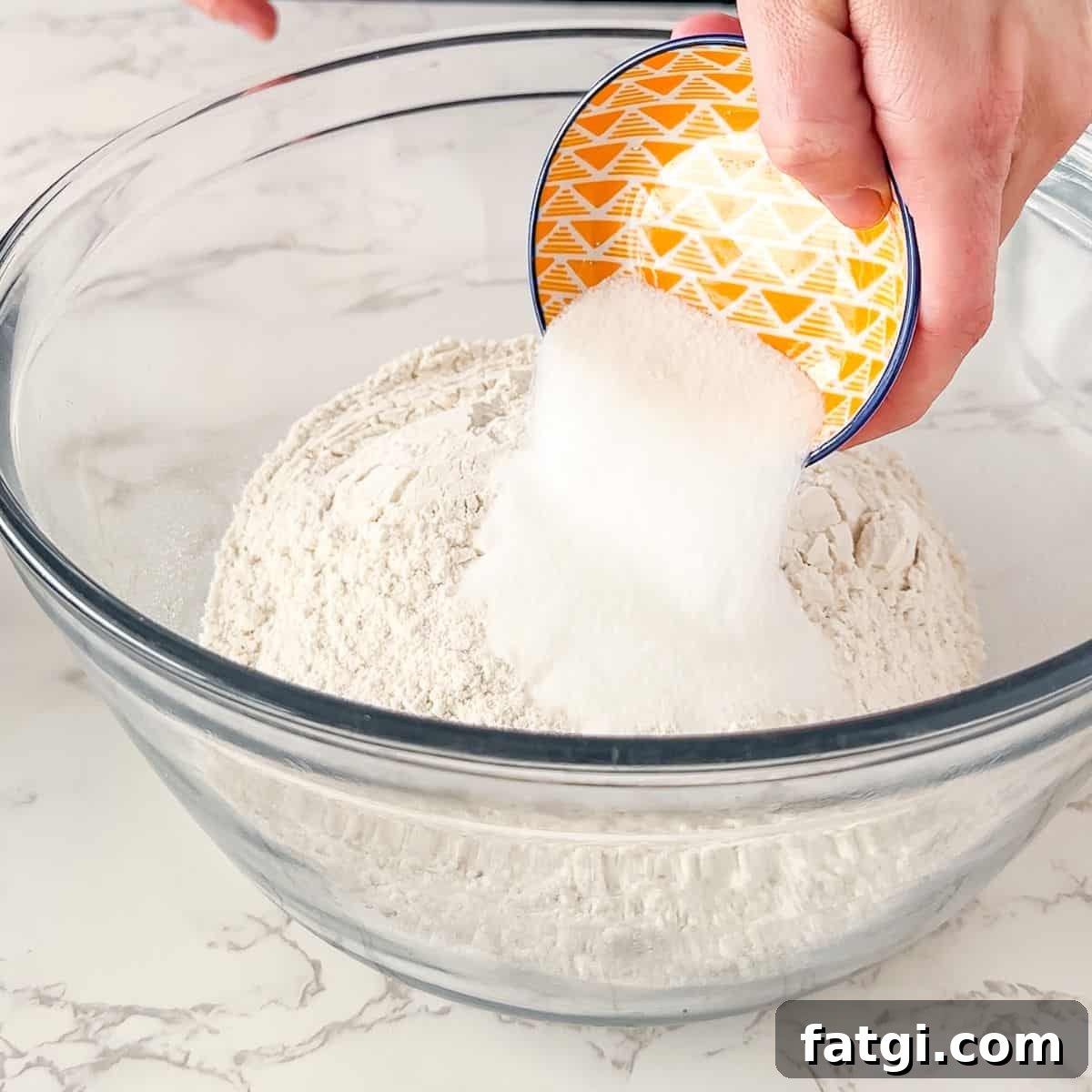 Adding dry ingredients for Irish Soda bread. 