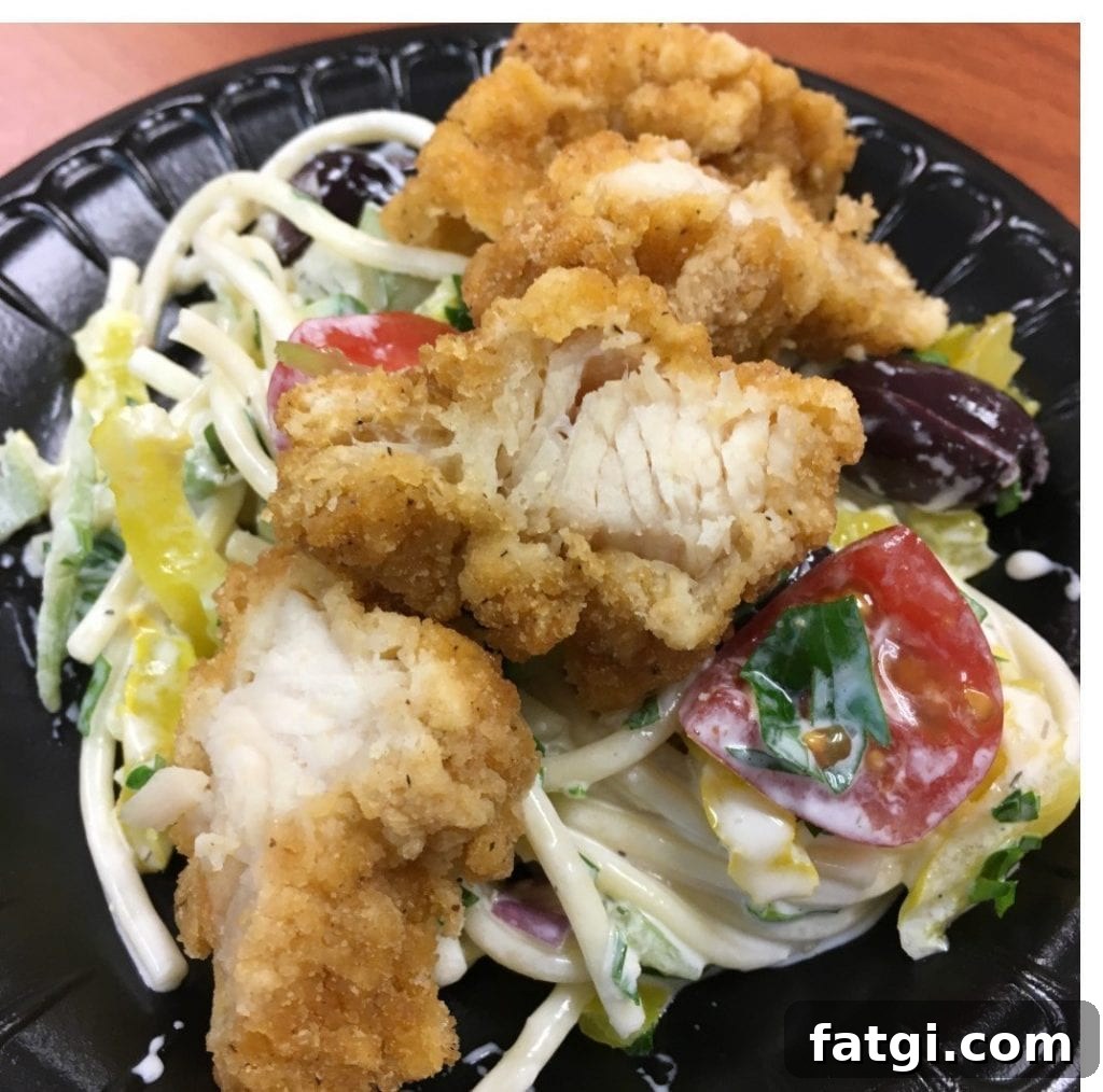 Crispy chicken salad with veggie pasta and lemon-dill yogurt sauce