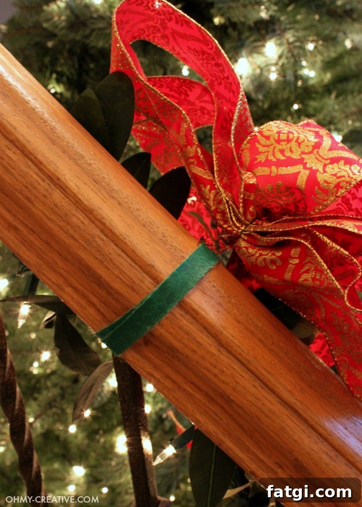 How to Hang Garland on a Staircase Banister 5 Back view of Velcro ties holding Christmas garland on a staircase banister