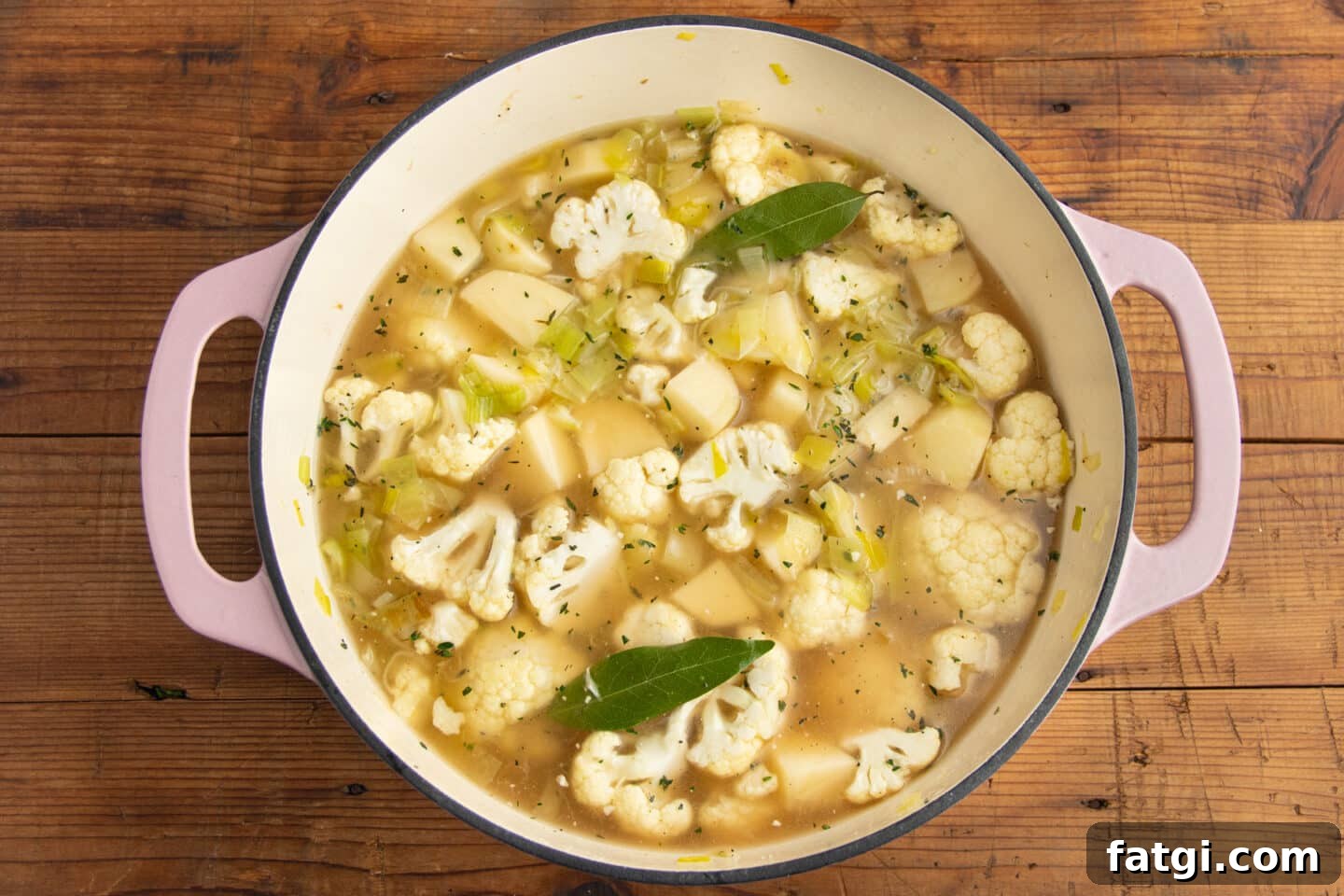 Creamy Cauliflower, Potato and Leek Soup Recipe 6 This is a picture of a big pot with the veggies and broth added.