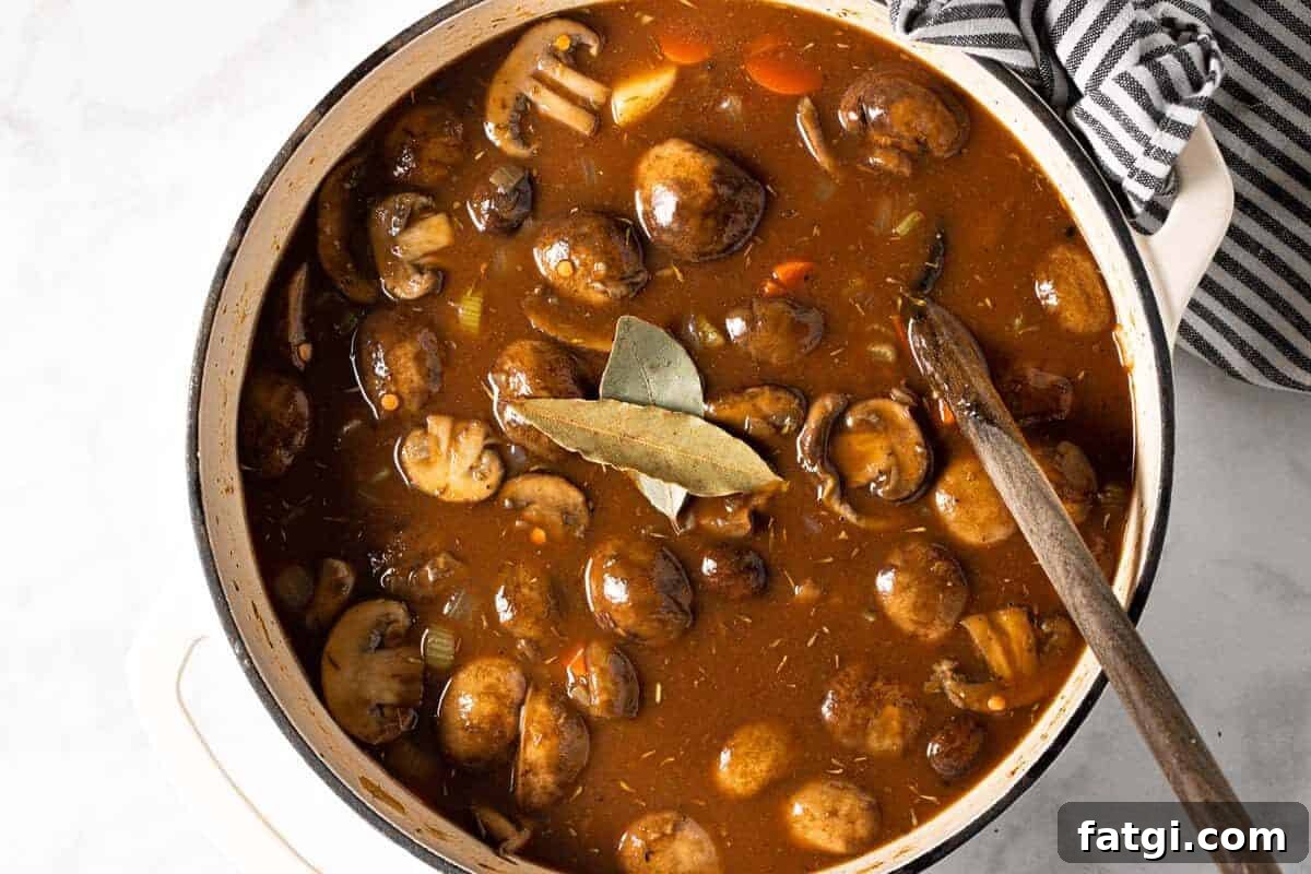 Large white pot filled with ingredients to make easy vegan stew