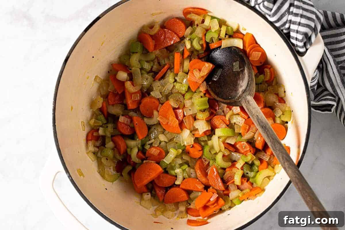 Large white pot filled with sauteed veggies