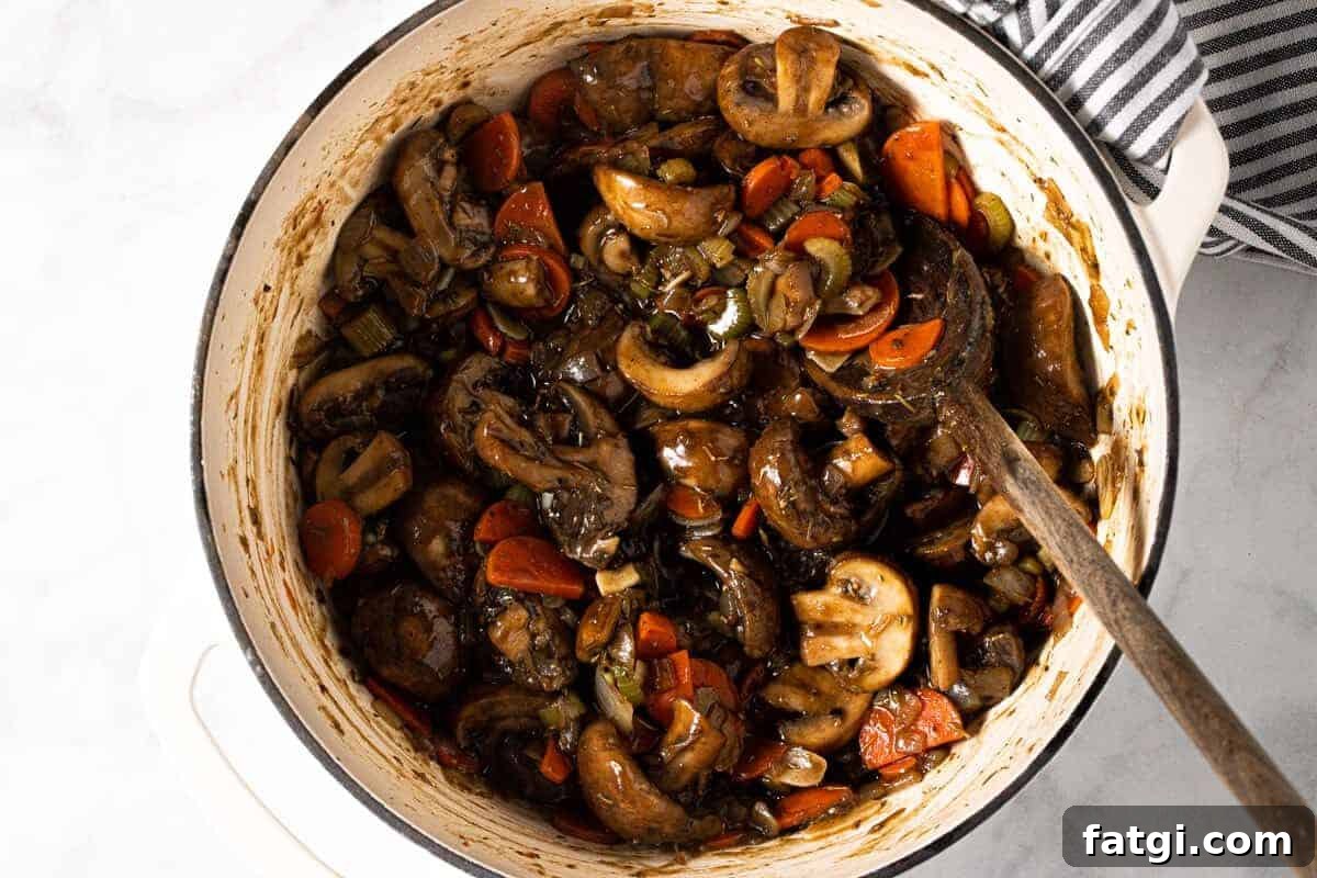 Large white pot filled with ingredients to make easy vegan stew