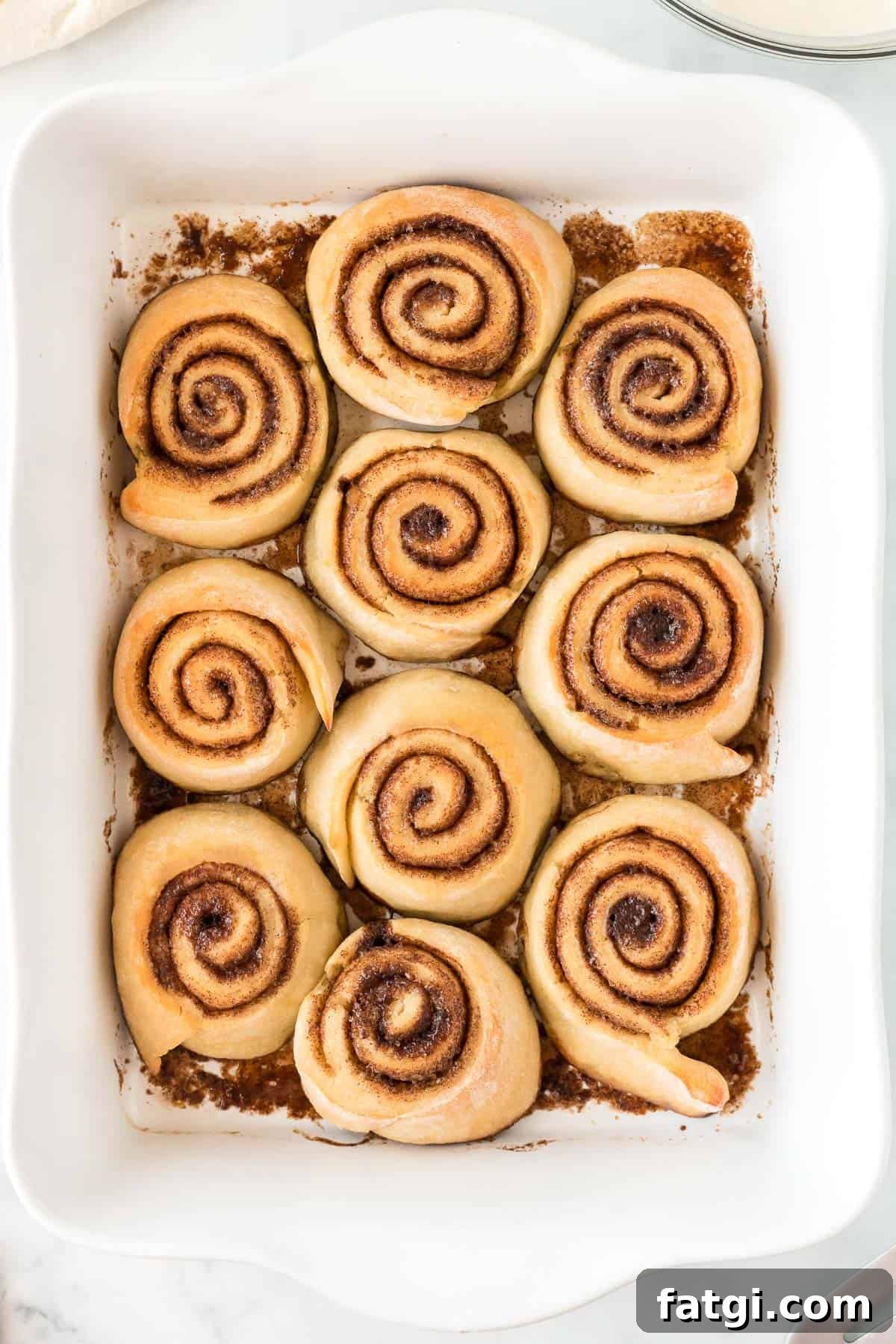 baked cinnamon rolls in the baking dish