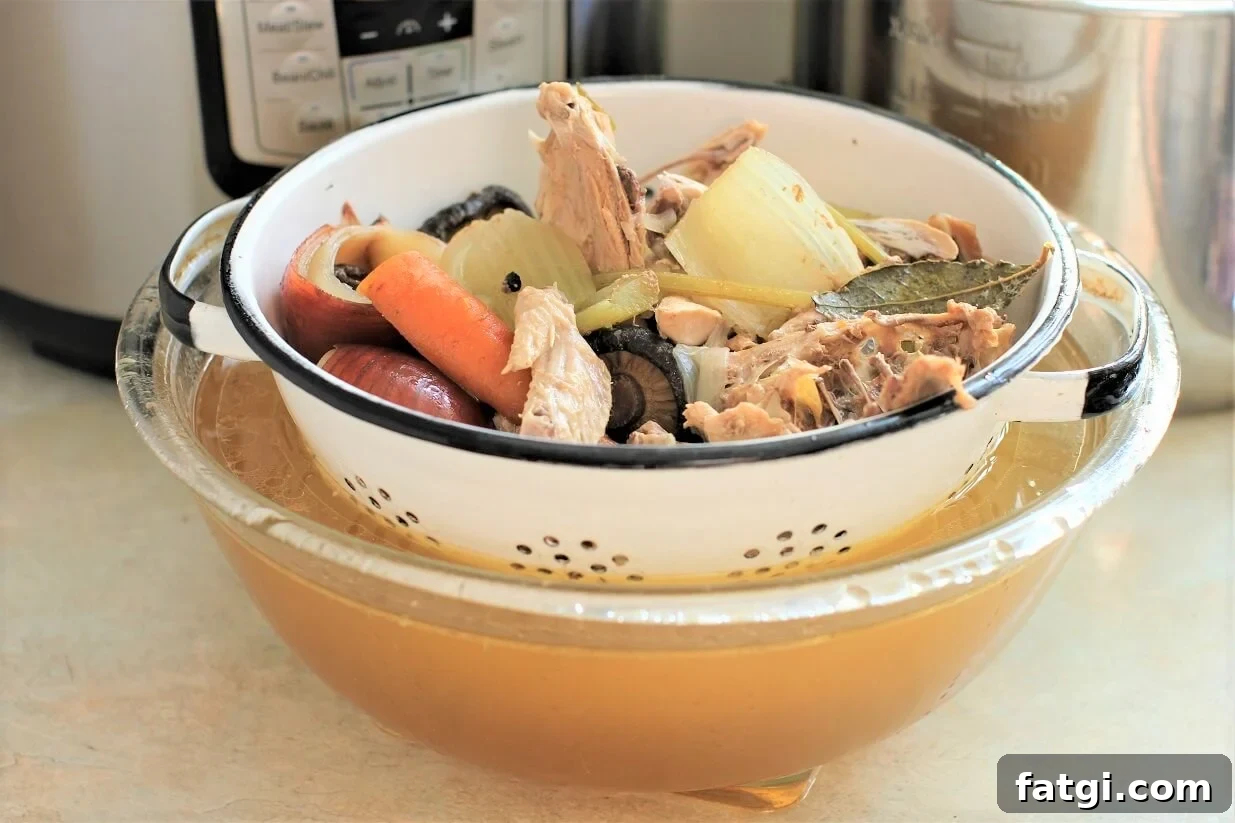 straining the stock ingredients in the colander
