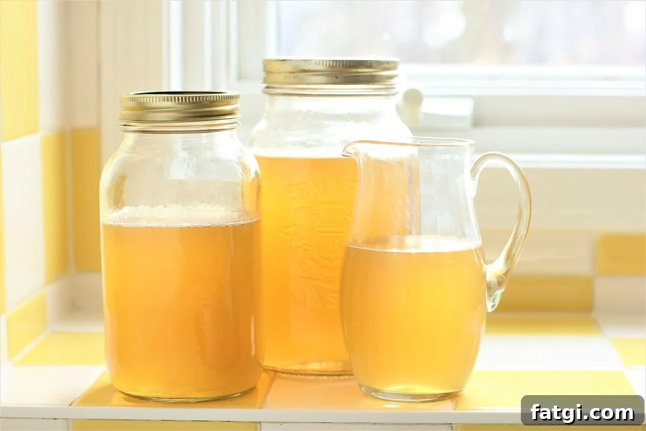 two jars and a jug of Instant Pot Chicken Stock