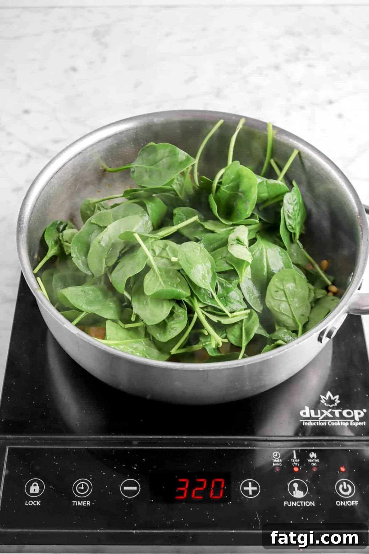 spinach added to pan