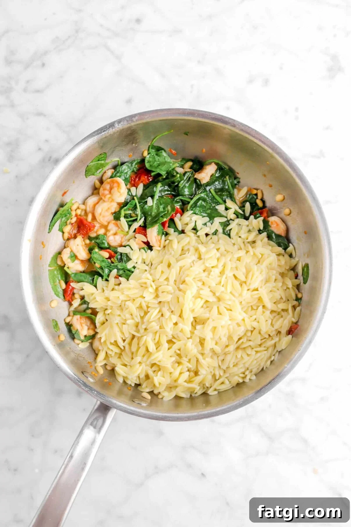 orzo added to shrimp and spinach mixture