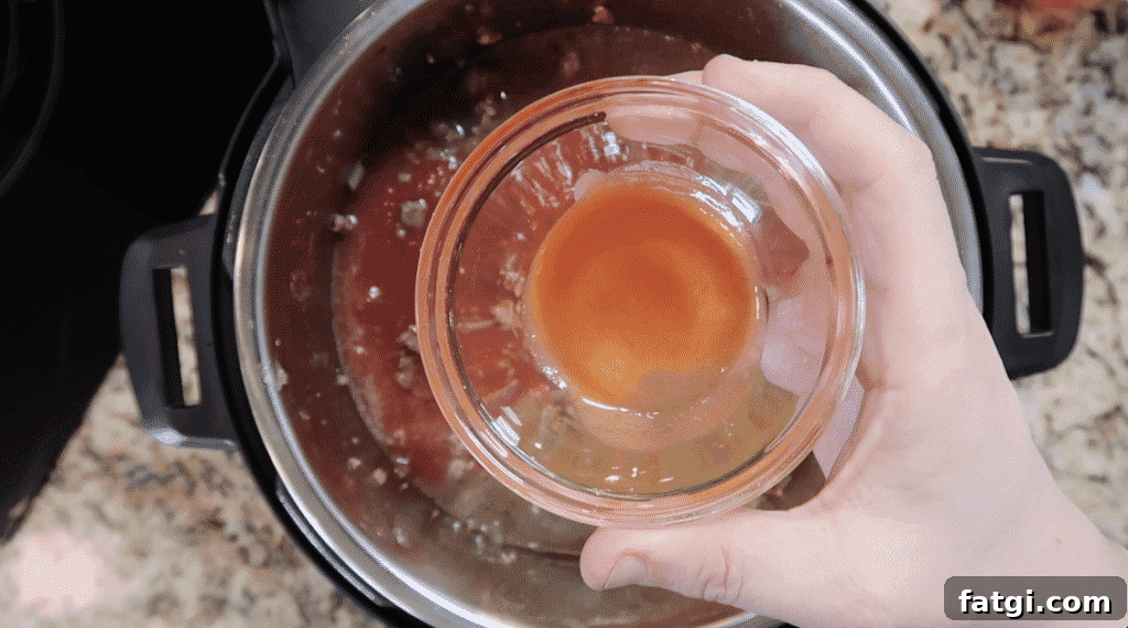 Adding hot sauce to pot