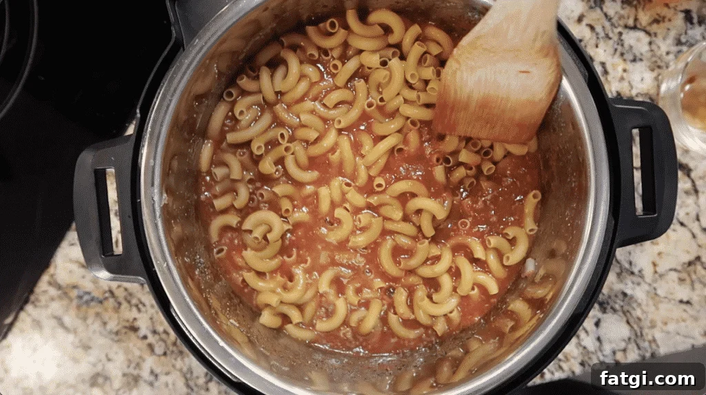 Smoothing out pasta in pot