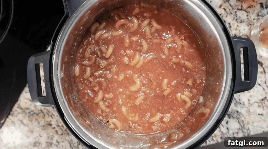 Pasta submerged in sauce.