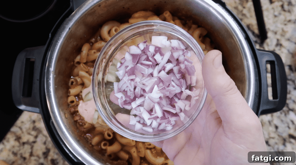 Adding red onion to pot