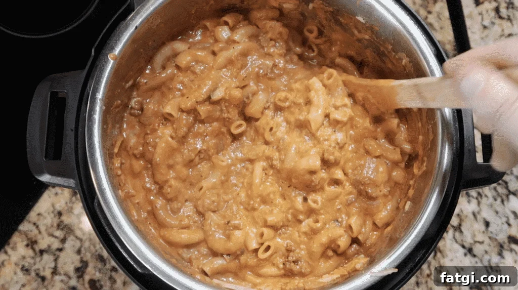 Stirring pot so cheese melts into sauce