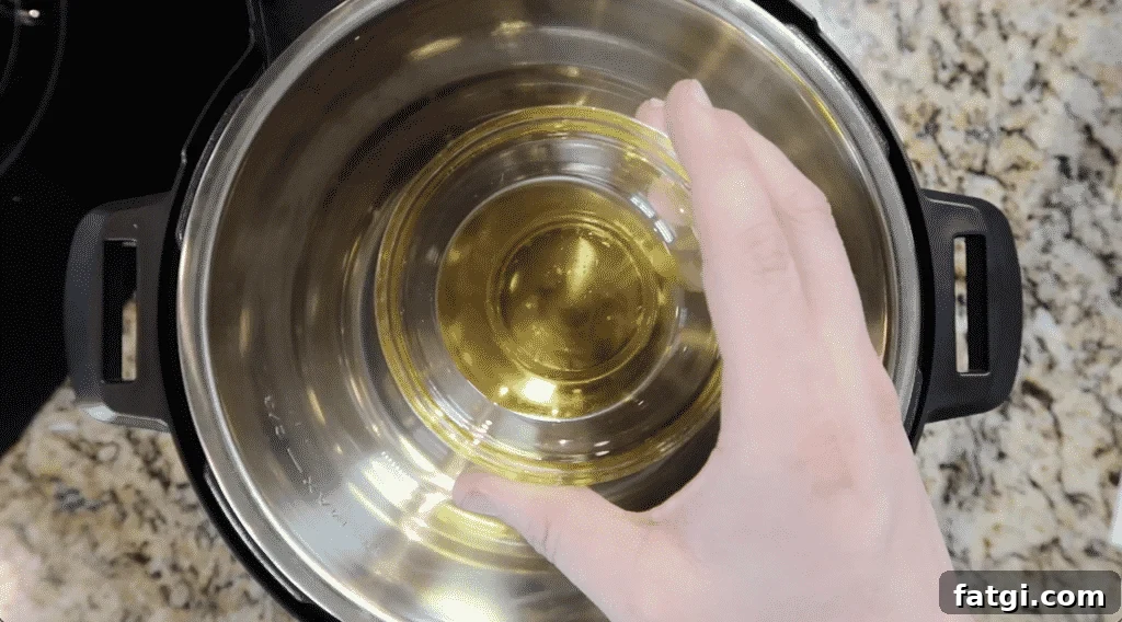 Adding olive oil to pot