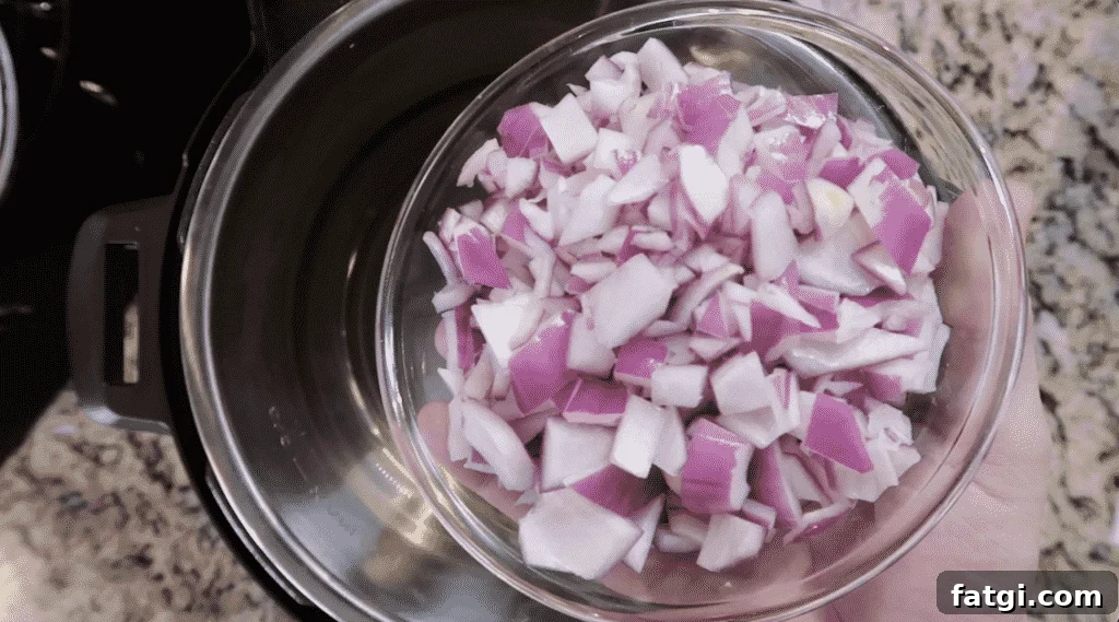 Adding onion to the pot